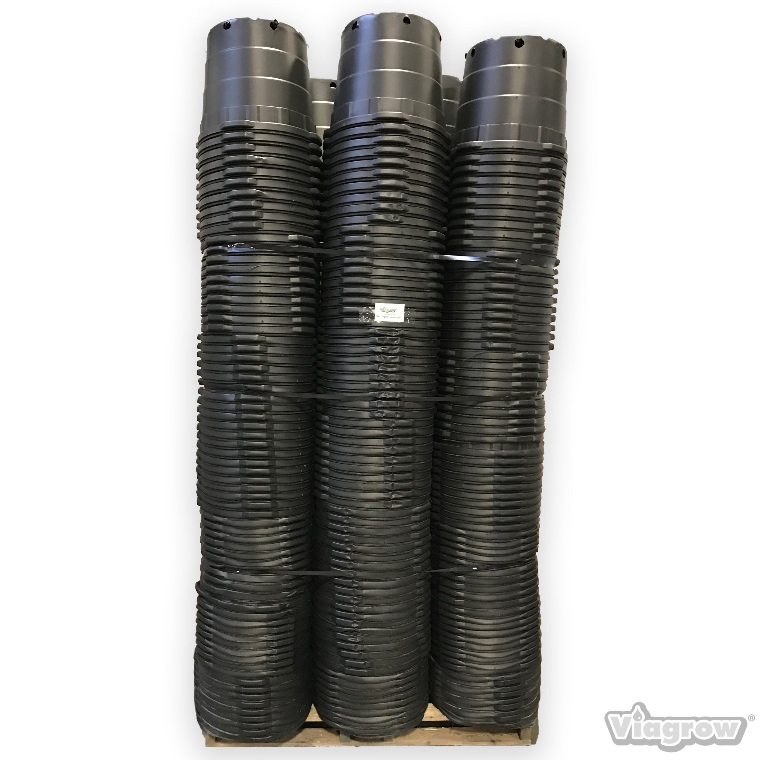 A stack of black 10 gallon nursery pots with visible drain holes, intended for large-scale planting.